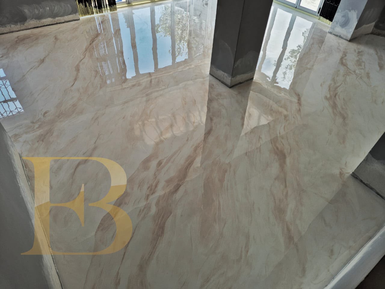 Cream marble-effect epoxy floor with mirror gloss